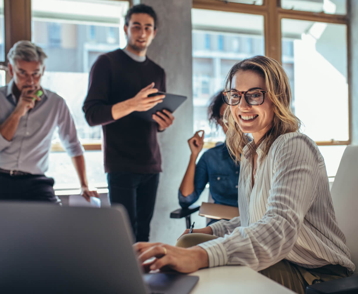 Diverse team collaborating in an office setting.